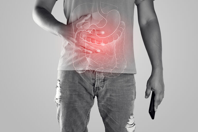Man with hands on stomach, illustration highlighting digestive tract